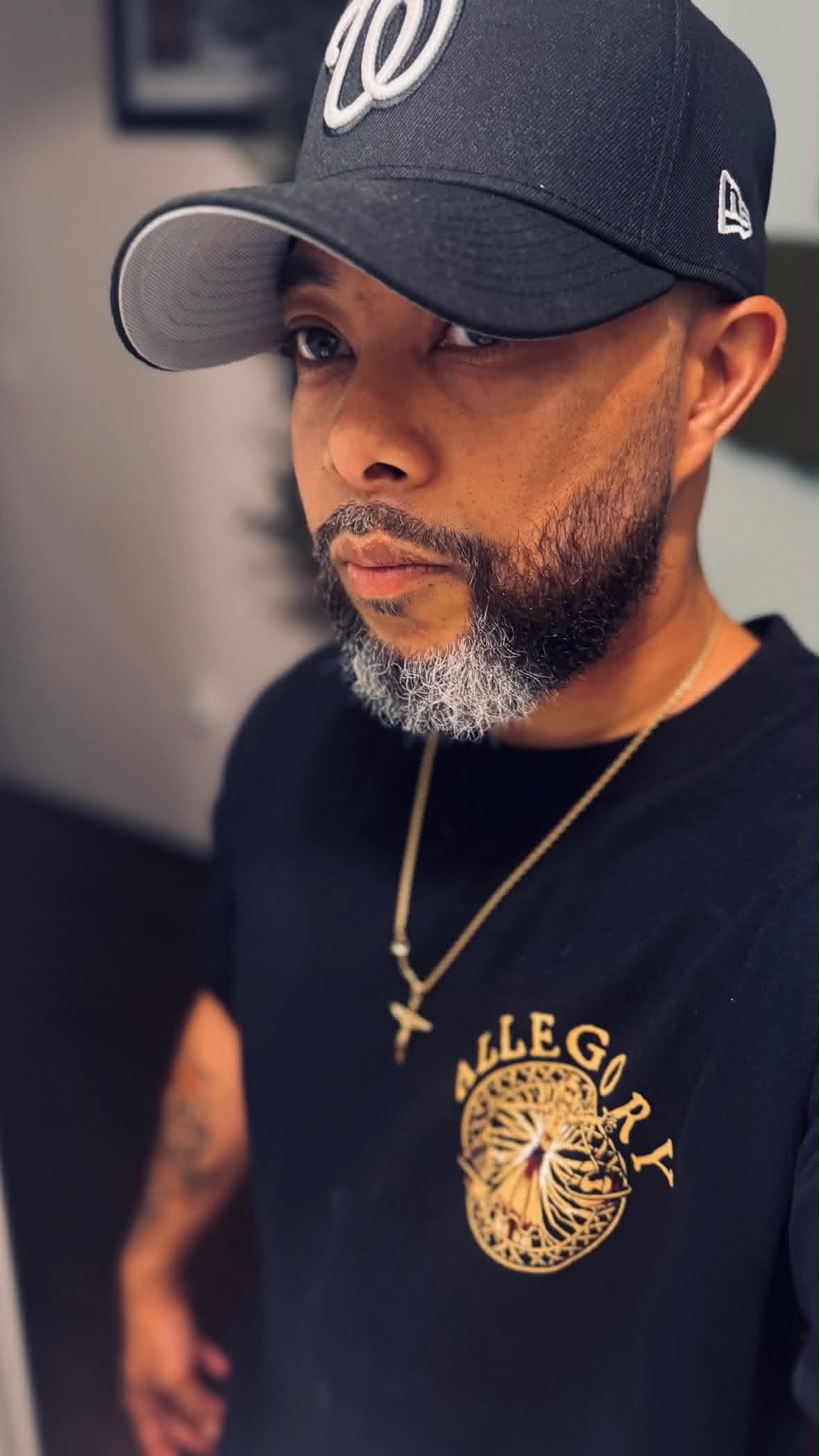 BTGplays wearing a black Washington Nationals cap